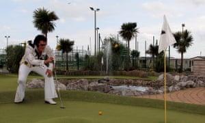 It is a holiday after all... A festival goer enjoys the minigolf facilities at Porthcawl. The event has run in Wales for 11 years and even has a sister event in Benidorm.